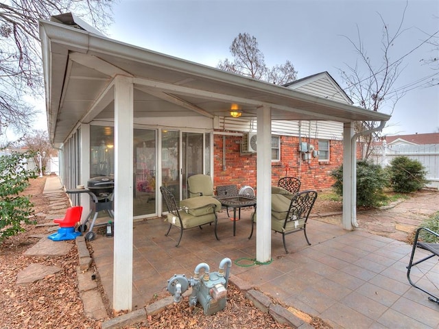 view of patio with an outdoor fire pit