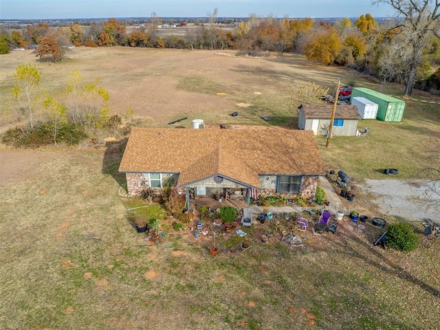 birds eye view of property featuring a rural view