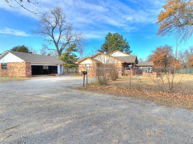 view of front of property with a garage and an outdoor structure