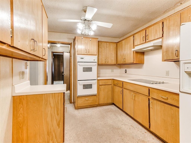 kitchen with ceiling fan, light colored carpet, white appliances, and a textured ceiling