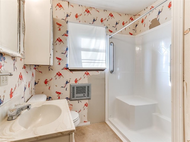 bathroom with a shower, vanity, heating unit, and toilet