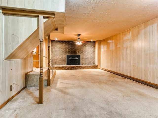 unfurnished living room with light carpet and wooden walls