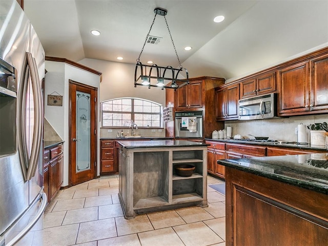 kitchen with hanging light fixtures, stainless steel appliances, backsplash, lofted ceiling, and light tile patterned flooring