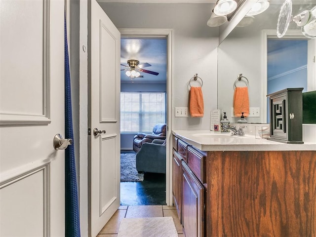 bathroom with tile patterned floors, vanity, and ceiling fan