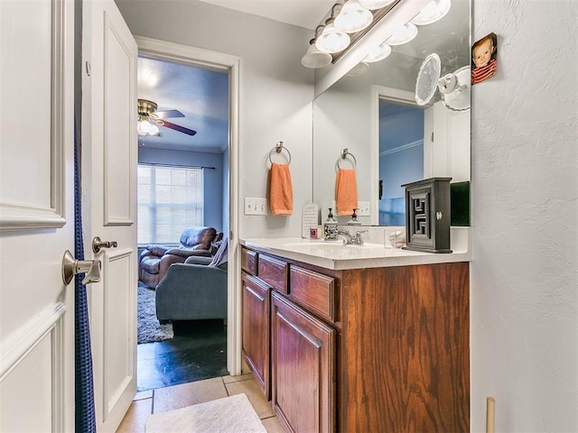 bathroom featuring tile patterned flooring, vanity, and ceiling fan