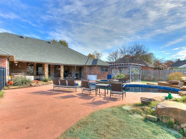 view of swimming pool featuring a gazebo and a patio