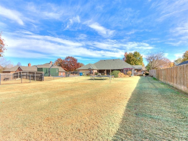 view of yard with a trampoline