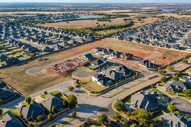 8409 NW 128th St, Oklahoma City, OK 73142 - aerial overview of property's location featuring nearby suburban area and a nearby body of water
