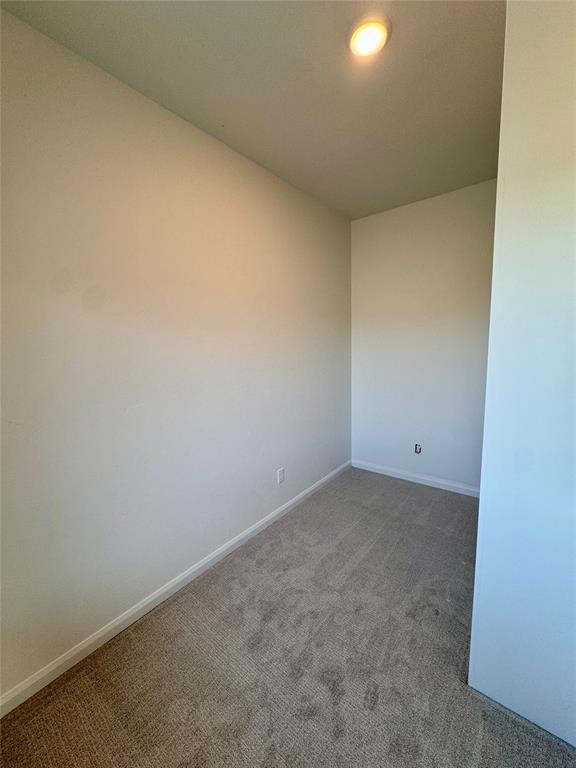 8409 NW 128th St, Oklahoma City, OK 73142 - empty room featuring carpet and baseboards