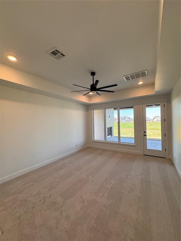 8409 NW 128th St, Oklahoma City, OK 73142 - unfurnished room featuring light colored carpet, a ceiling fan, baseboards, and recessed lighting