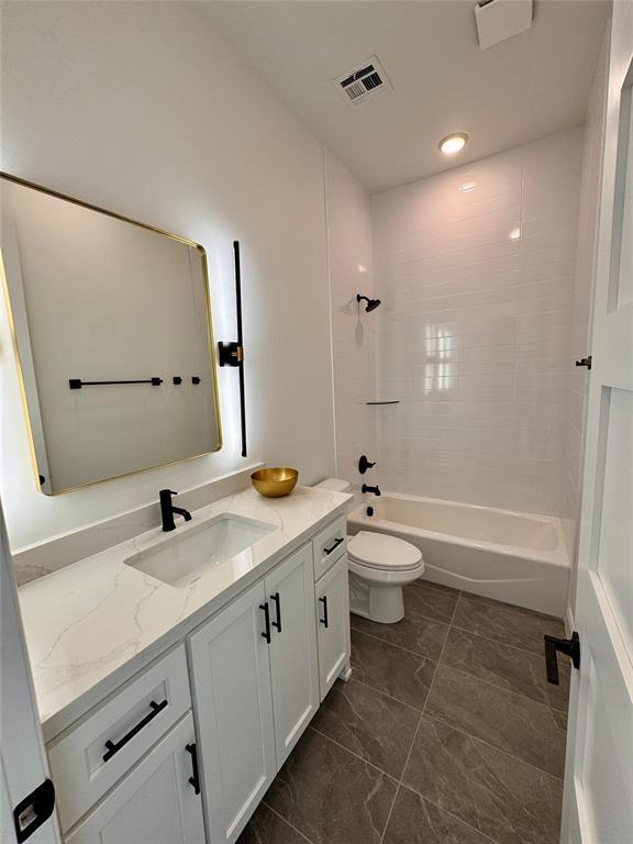 8409 NW 128th St, Oklahoma City, OK 73142 - bathroom featuring vanity, toilet, shower / washtub combination, marble finish flooring, and recessed lighting