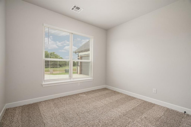 empty room with carpet flooring