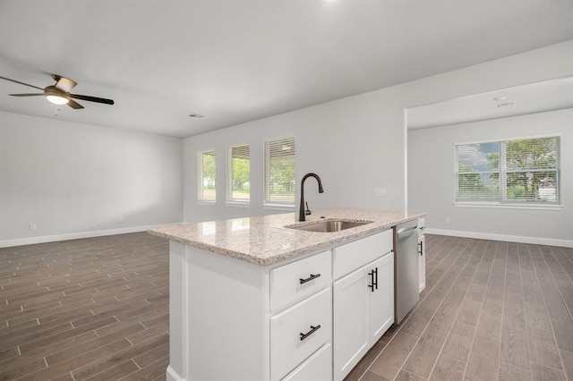 kitchen with dishwasher, a kitchen island with sink, white cabinets, sink, and dark hardwood / wood-style floors