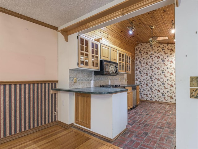 kitchen with ceiling fan, ornamental molding, backsplash, and kitchen peninsula