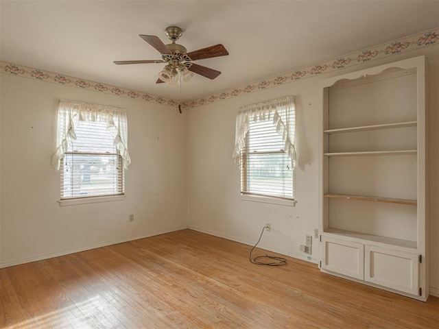 unfurnished room with ceiling fan and light hardwood / wood-style flooring