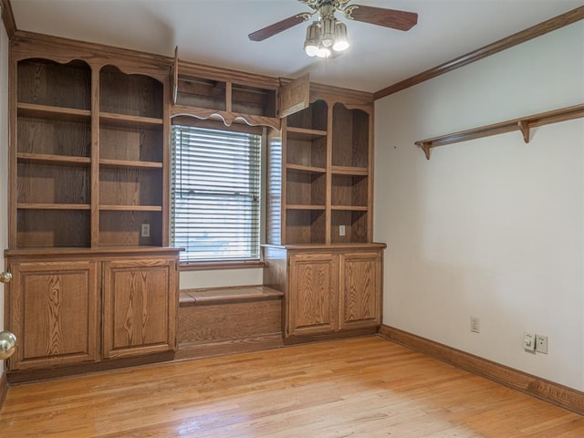 unfurnished office featuring ceiling fan, light hardwood / wood-style floors, and ornamental molding