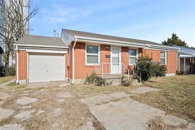 single story home featuring a garage and a front yard