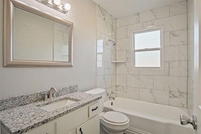 full bathroom featuring toilet, vanity, and tiled shower / bath