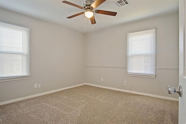 unfurnished room featuring carpet, ceiling fan, and a healthy amount of sunlight