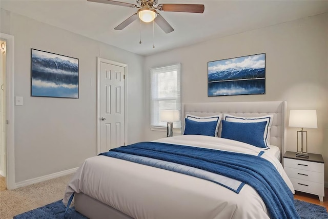 carpeted bedroom featuring ceiling fan