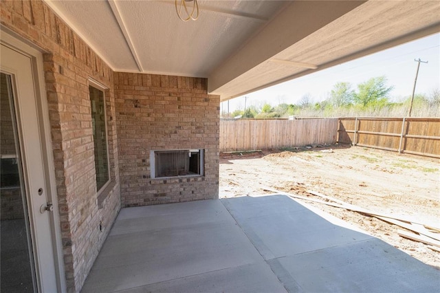 view of patio featuring fence
