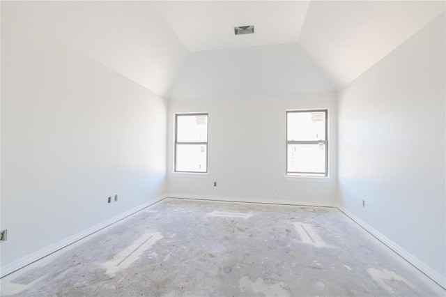 unfurnished room featuring a wealth of natural light, baseboards, and lofted ceiling