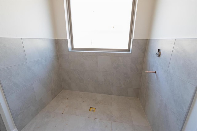 full bathroom with tiled shower