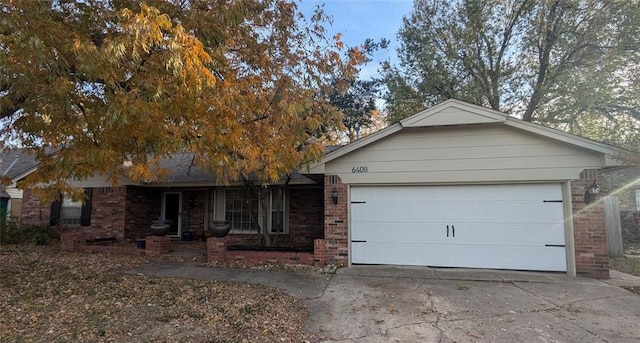 ranch-style home with brick siding, a garage, and driveway