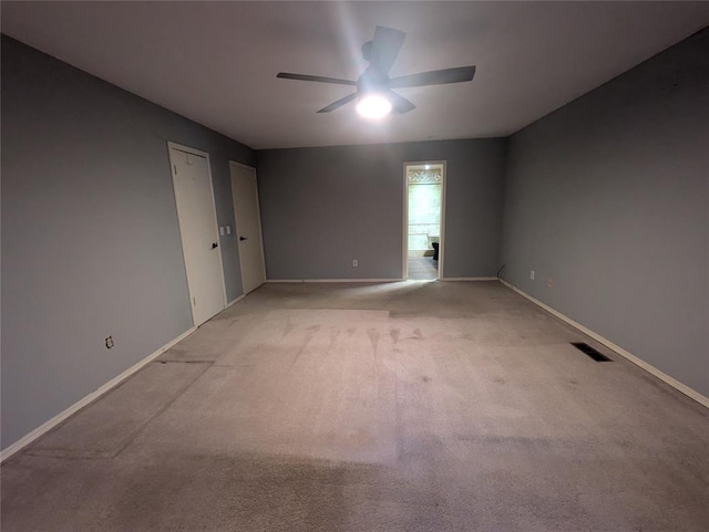 empty room with light carpet and ceiling fan