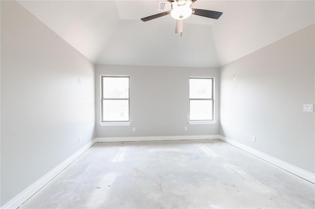 unfurnished room with baseboards, plenty of natural light, unfinished concrete flooring, and ceiling fan