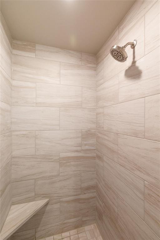 full bath with a tile shower