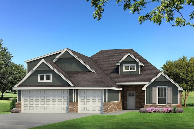 craftsman house featuring a garage and a front lawn