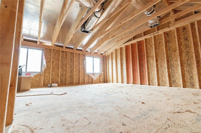 miscellaneous room with lofted ceiling