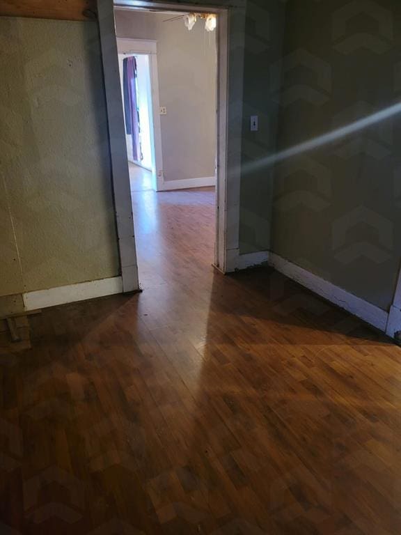 spare room with dark hardwood / wood-style floors