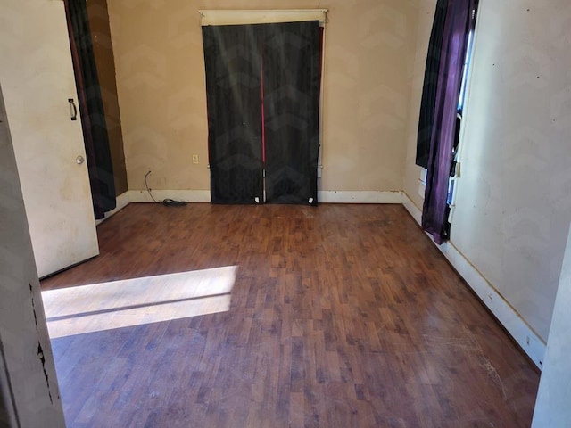 spare room featuring dark hardwood / wood-style floors