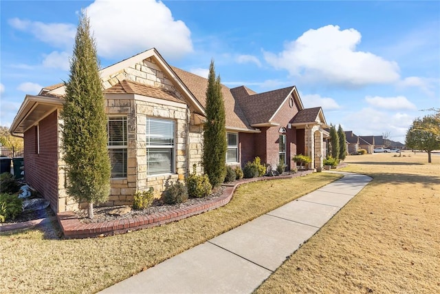 view of front of home with a front yard