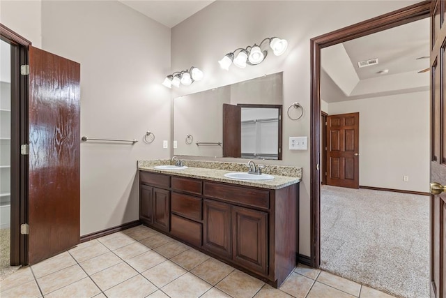 bathroom with tile patterned flooring and vanity