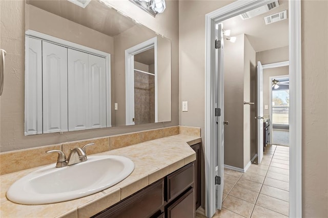 bathroom featuring tile patterned flooring and vanity