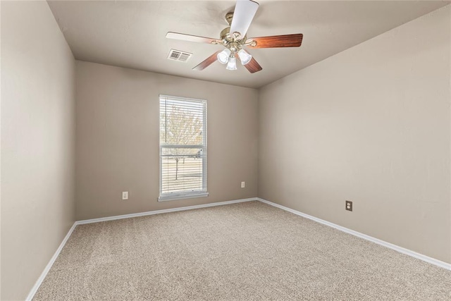 empty room featuring carpet and ceiling fan