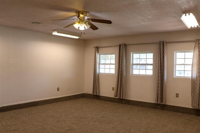 unfurnished room with ceiling fan, carpet, and a healthy amount of sunlight