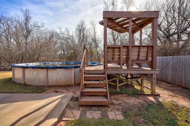 view of play area featuring a covered pool