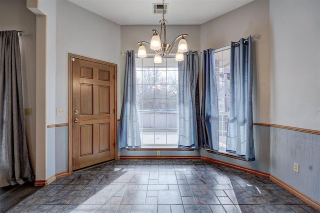 interior space with a notable chandelier