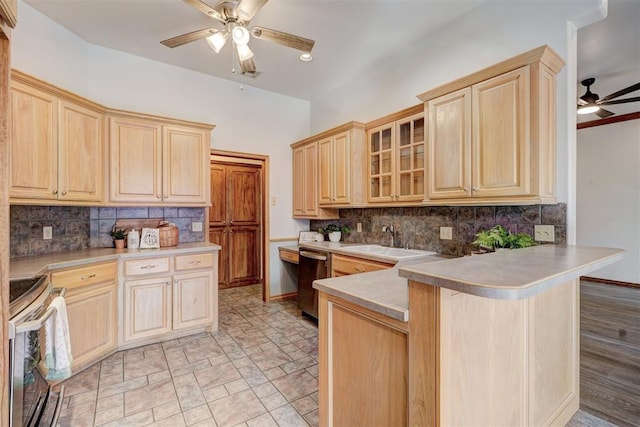 kitchen with light brown cabinetry, sink, kitchen peninsula, and stainless steel appliances