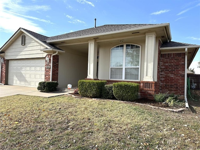 ranch-style house featuring a front yard and a garage