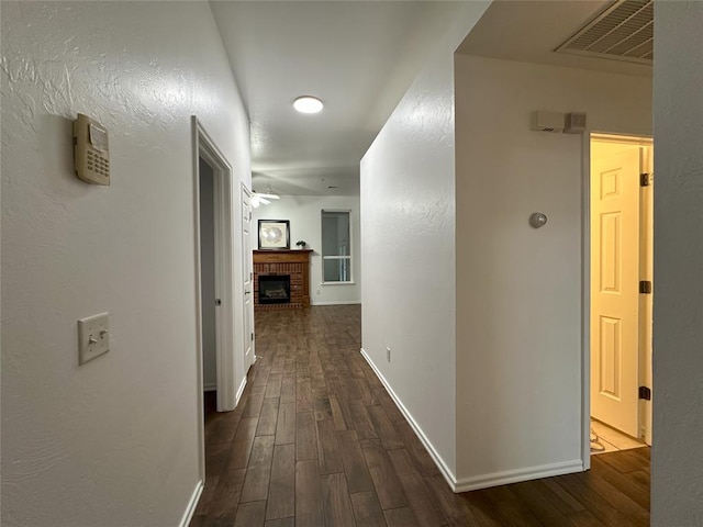 hall with dark wood-type flooring