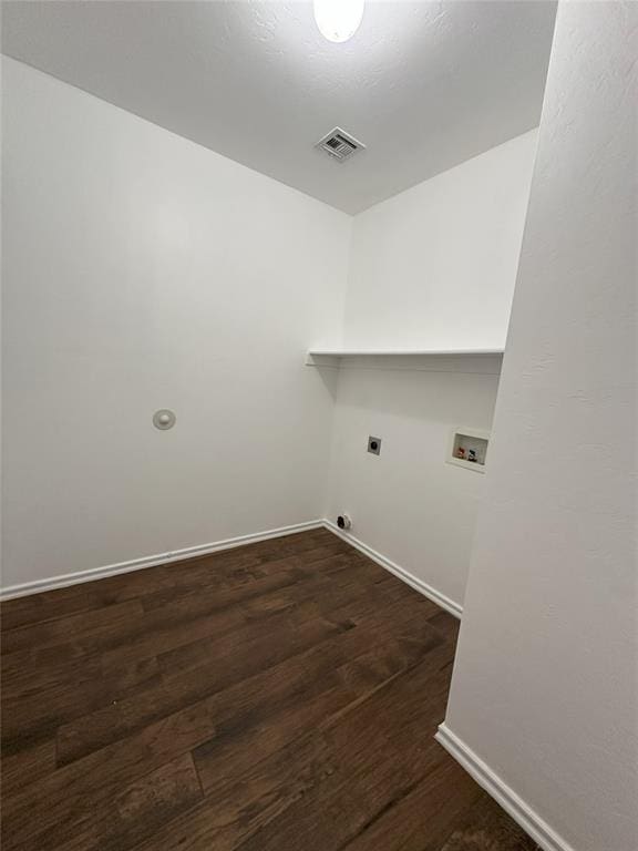 laundry area with hookup for an electric dryer, dark hardwood / wood-style flooring, and hookup for a washing machine