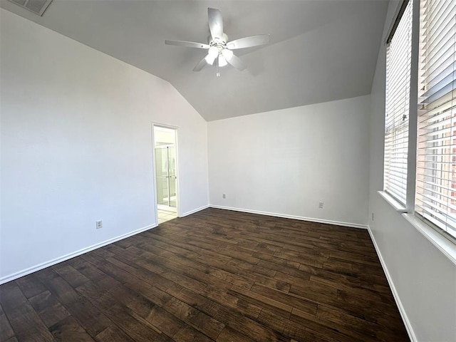 unfurnished room with vaulted ceiling, ceiling fan, and dark hardwood / wood-style floors