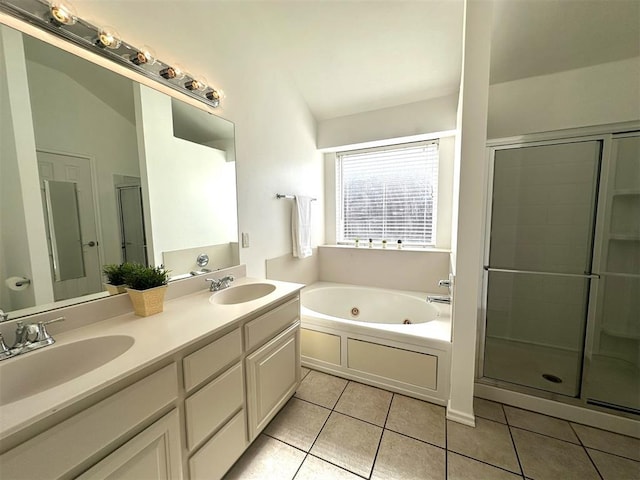 bathroom with tile patterned flooring, vanity, and shower with separate bathtub