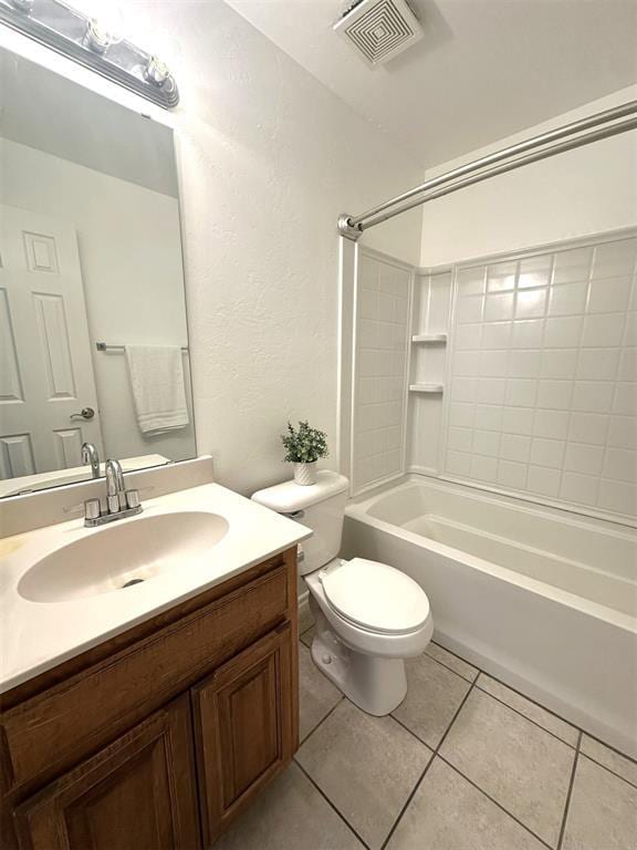 full bathroom featuring washtub / shower combination, vanity, tile patterned floors, and toilet