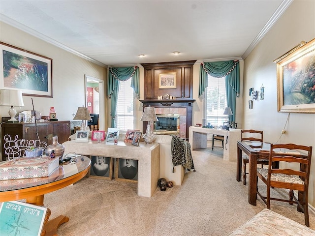 living room with a fireplace, light colored carpet, and crown molding